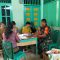 Foto : Babinsa Koramil 05/Kolang, Serda Rumondang Simanullang saat mendampingi pelaksanaan Posyandu di Kantor Kepala Desa Naga Timbul, Kecamatan Sitahuis, Kabupaten Tapanuli Tengah.