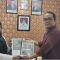 Foto : Maulana menyerahkan buku tentang ekosistem Orangutan Tapanuli kepada Kepala Dinas Lingkungan Hidup Kabupaten Tapanuli Tengah, Erniwati Batunara